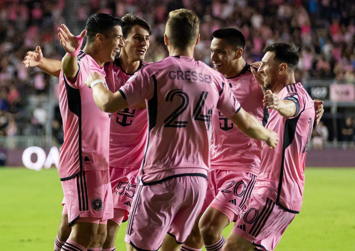 Inter Miami forward Luis Suárez (9) celebrates with his teammates after scoring a goal against Nashville SC goalkeeper Joe Willis (1) in the first half of their CONCACAF Champions Cup tournament soccer match at Chase Stadium on Wednesday, March 13, 2024, in Fort Lauderdale, Fla.