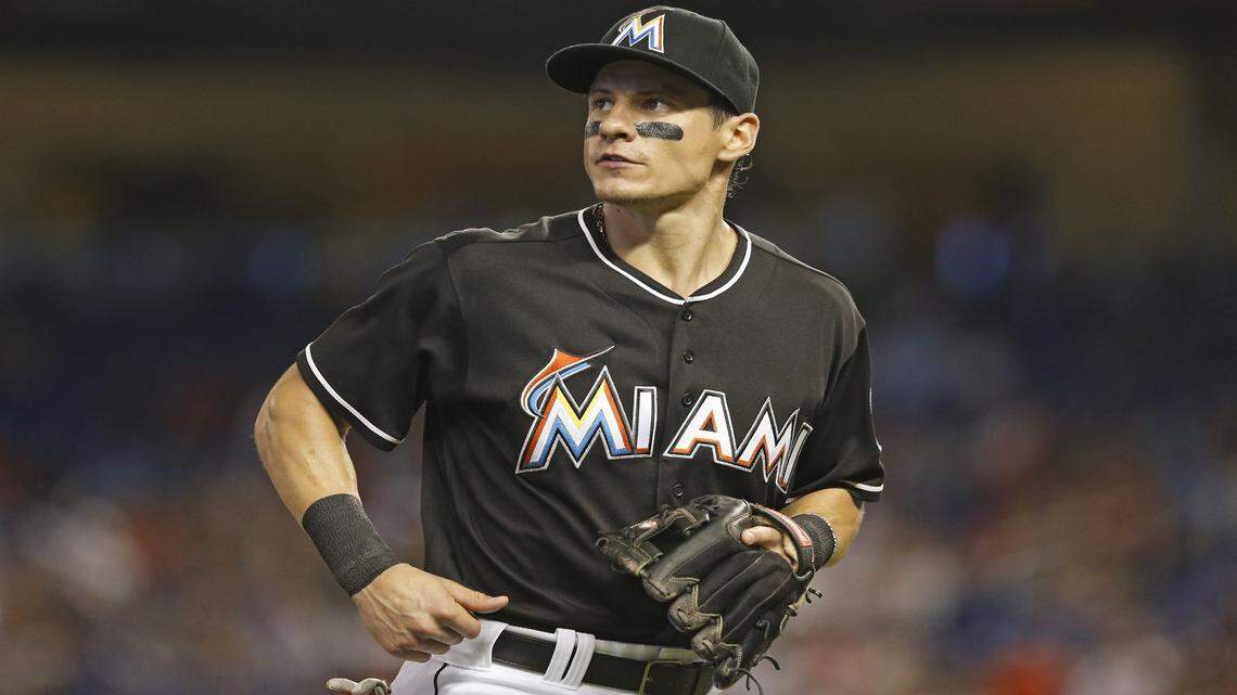 Miami Marlins second baseman Derek Dietrich (32) runs off the field as the Miami Marlins host the Cincinnati Reds at Marlins Park on Saturday, July 9, 2016.