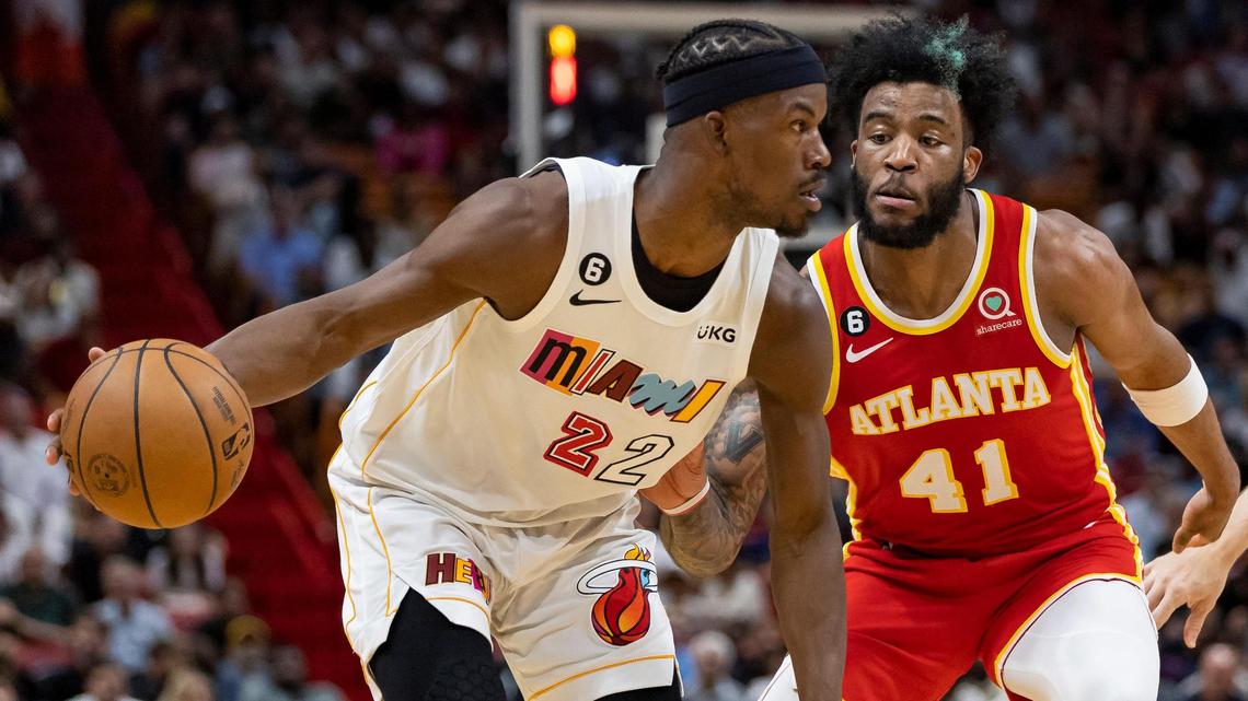 Miami Heat forward Jimmy Butler (22) looks to pass the ball as Atlanta Hawks forward Saddiq Bey (41) defends during the second quarter of an NBA game at Miami-Dade Arena on Monday, March 6, 2023, in downtown Miami.