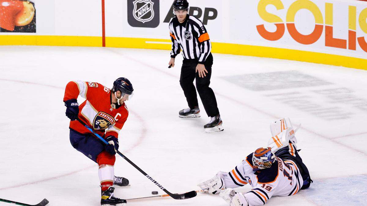 Edmonton Oilers goaltender Mikko Koskinen (19) blocks a shot by Florida Panthers center Aleksander Barkov (16) during the second period of an NHL game at the FLA Live Arena on Saturday, February 26, 2022 in Sunrise, Fl.