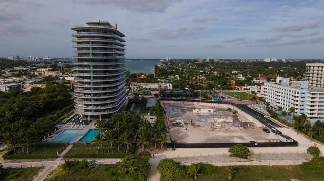 The 18-story Eighty Seven Park tower looms over the footprint where Champlain Towers South once stood.
