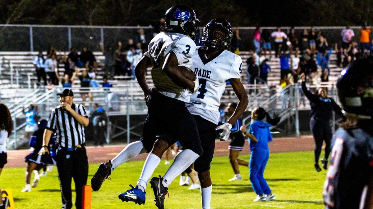 South Dade teammates Sedric Melvin and Edward Farley-Kendrick react to defeating Southridge 33-30 at Southridge Stadium in Miami, Florida, on Friday, November 3, 2023.