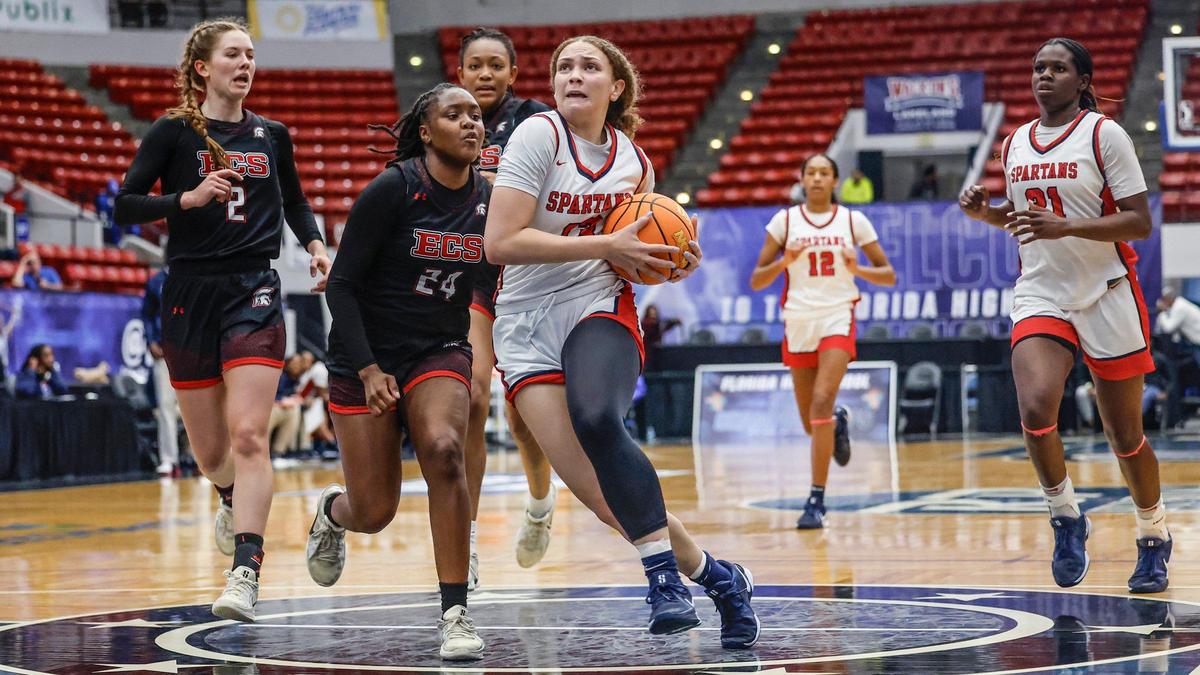 Miami Country Day’s Jalynn Belton (13) drives the ball to the basket against Evangelical Christian in the first half during girls basketball state semifinal of the Florida High School State Championships at the RP Funding in Lakeland, Florida on Thursday, February 27, 2025.
