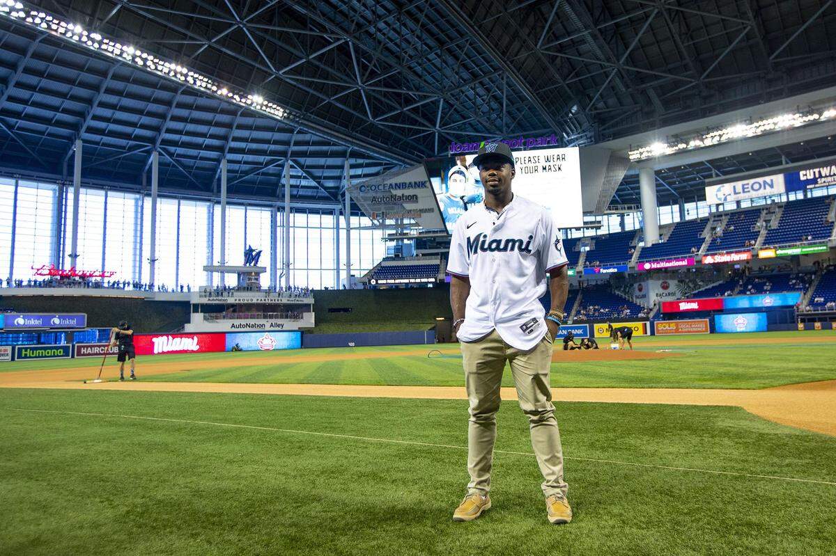 Miami Marlins 16th overall pick in the 2021 Major League Baseball draft, Kahlil Watson, takes a photo on the field before the first inning of an MLB game against the New York Yankees at loanDepot park in the Little Havana neighborhood of Miami, Florida, on Sunday, August 1, 2021.