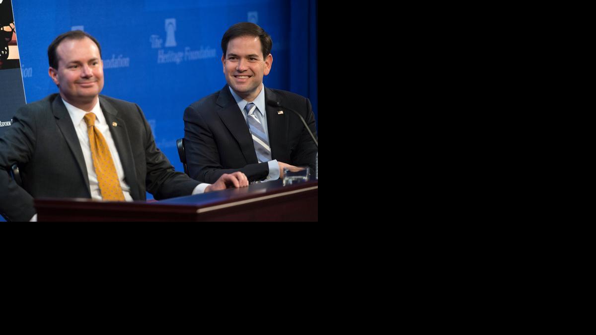 
Republican presidential candidate, Sen. Marco Rubio, R-Fla., right, accompanied by Sen. Mike Lee, R-Utah, discuss their recently released tax reform plan at the Heritage Foundation in Washington, Wednesday, April 15, 2015.
