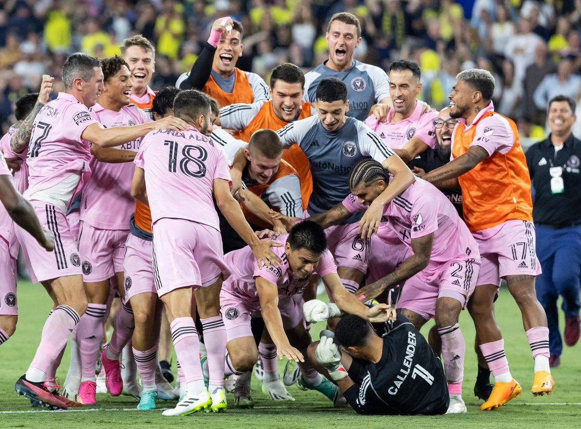 Inter Miami players celebrate with goalkeeper Drake Callender after he blocked the last penalty shot from Nashville SC goalkeeper Elliot Panicco to win the Leagues Cup final.