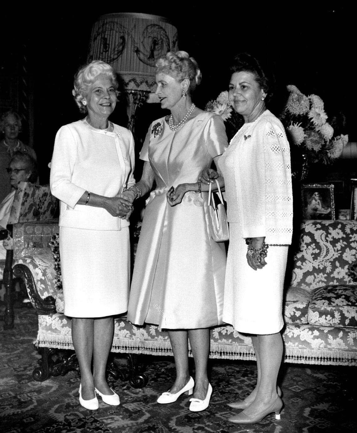 Mar-a-Lago’s former owner, Marjorie Merriweather Post, center, greets guests at the mansion for a 1968 party benefit.