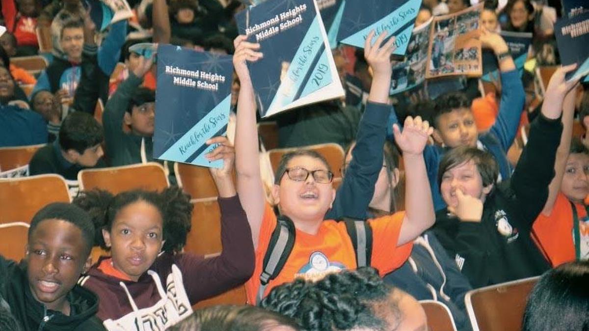Richmond Heights Middle School students celebrate finally having a school yearbook, the first one in seven years.