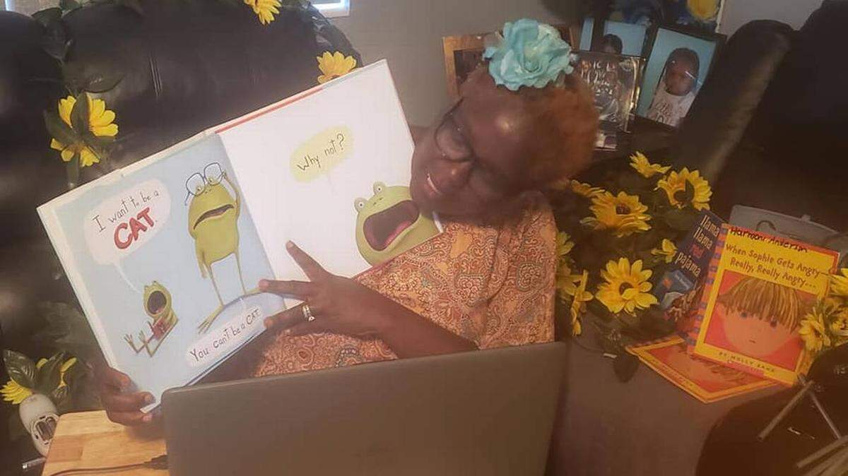 Cassandra Holmes, a pre-K teacher at Eneida M. Hartner Elementary school in Miami, reads to her students via Skype.