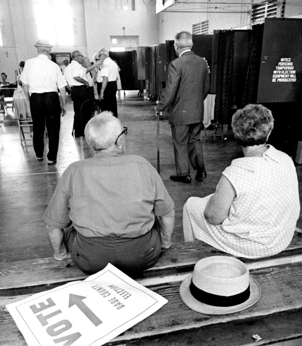 A couple rests before voting at Miami Beach in 1968.