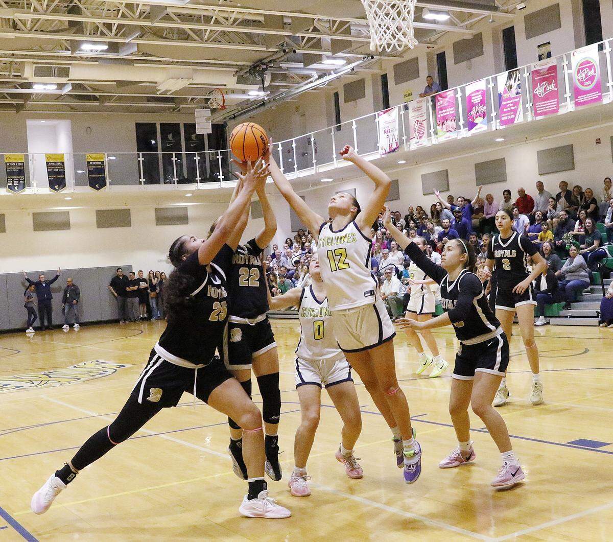 Carrollton and La Salle players fight for the rebound during Region 4-3A girls' basketball final game on Friday, February 27, 2026 at Carrollton School in Coconut Grove. Andrew Uloza / for Miami Herald