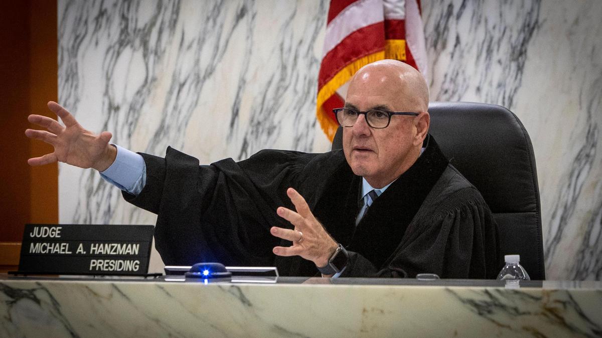 Judge Michael Hanzman gestures on May 11, 2022, as he speaks to attorneys in court where a settlement has been reached for Surfside condominium collapse victims.