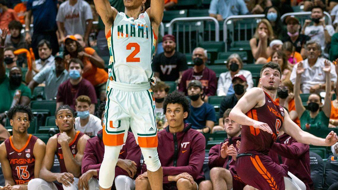University of Miami guard Isaiah Wong (2) shoots the three-point shot after losing Virginia Tech guard Hunter Cattoor (0) during the first half of an NCAA basketball game at the Watsco Center in Coral Gables, Florida, on Saturday, February 26, 2022.