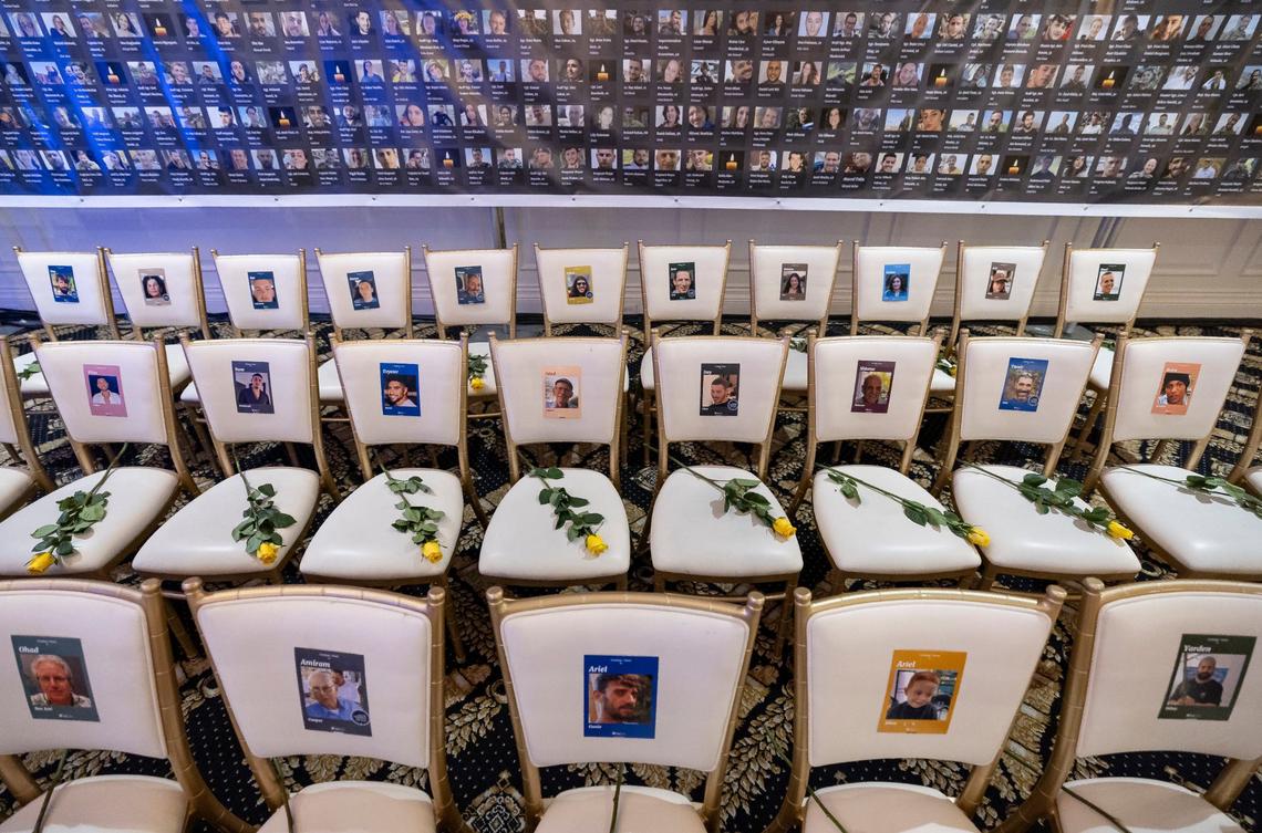 To honor the victims who lost their lives or were kidnapped in the Oct. 7 attacks in Israel by Hamas last year, photos are displayed and flowers are presented before Republican presidential candidate and former President Donald Trump hosts a remembrance event at Trump National Doral Miami on Monday, Oct. 7, 2024, in Doral, Fla.