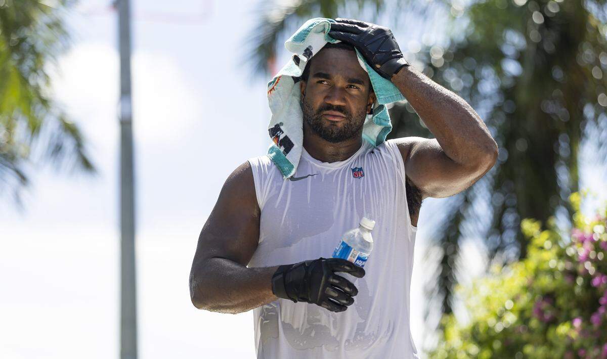 Miami Dolphins linebacker Tyrel Dodson (11) makes his way to speak with reporters after participating in training camp at the Baptist Health Training Complex on Tuesday, Aug. 19, 2025, in Miami Gardens, Fla.