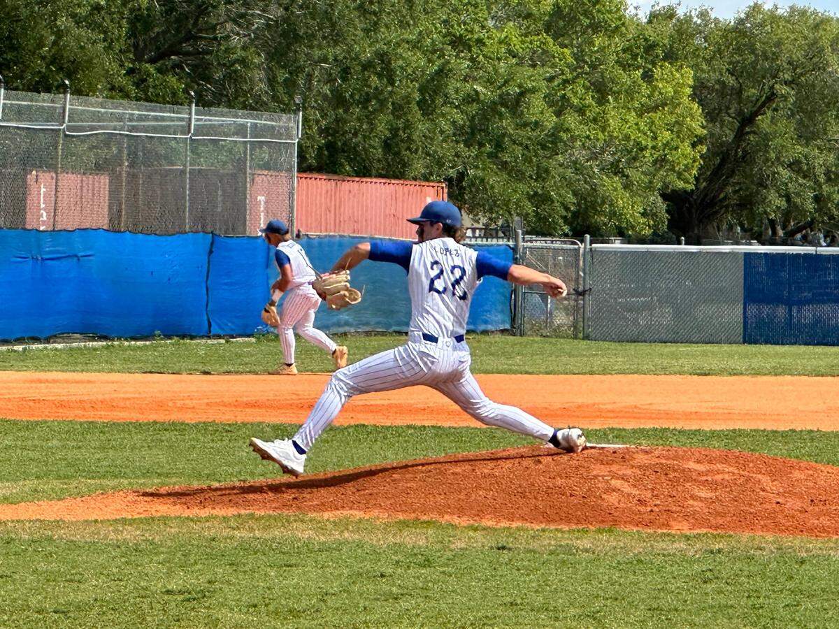 Braddock starting pitcher Devin Lopez throws a pitch against Boca Raton on Tuesday in a Region 4-7A quarterfinal playoff at the Bulldogs’ home field.