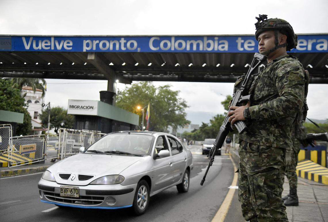 A Colombian soldier deployed in Cucuta, stands guard at the border crossing with neighboring Venezuela.