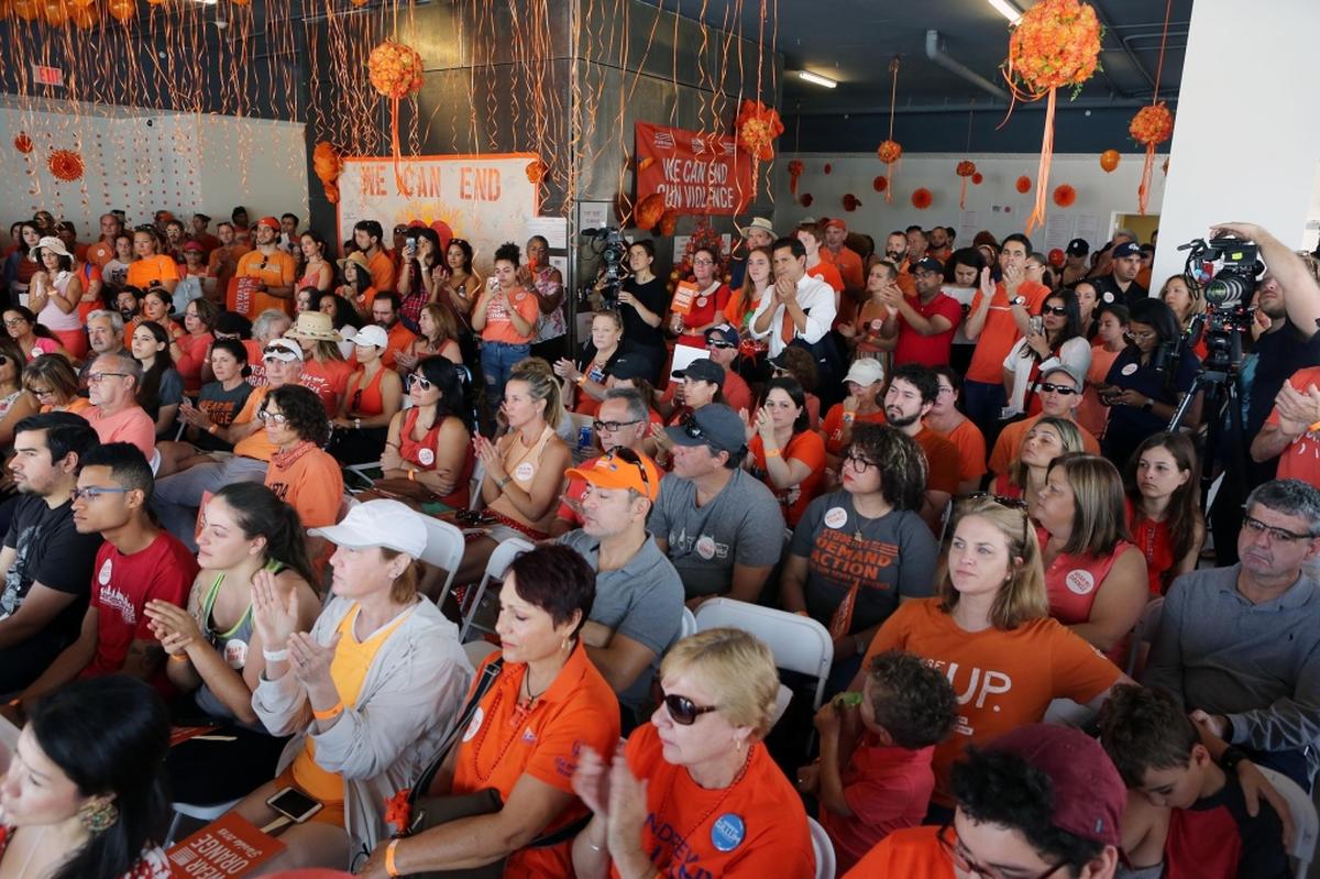 Dozens of people joined a Moms Demand Action Miami rally on Saturday, June 2, 2018, at Palm Court in the Design District.