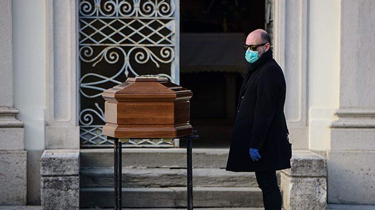 Coffin bearing Father Giuseppe Berardelli, who died after giving his respirator to another coronavirus patient who could not breathe.