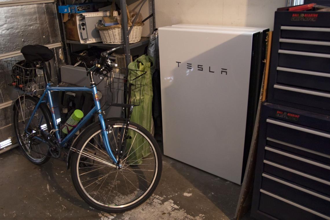 South Miami Mayor Philip Stoddard’s two Tesla Powerwall batteries were installed in the garage at his energy-efficient home in South Miami. Stoddard and his family went off the electrical grid for seven days and relied on their solar system in a trial run for hurricane season.