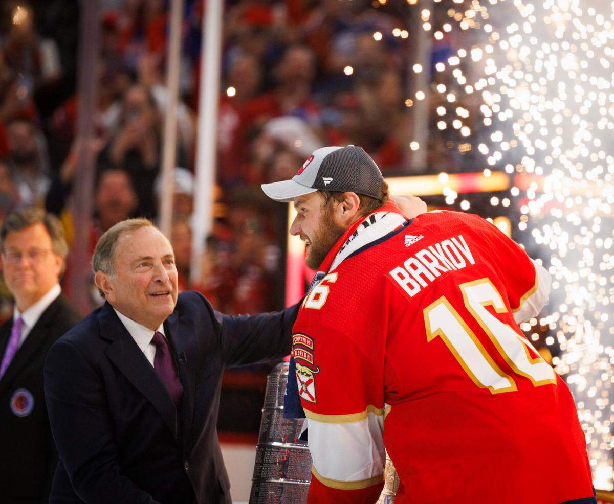 Florida Panthers center Aleksander Barkov (16) accepts the Stanley Cup after the Florida Panthers won Game 7 of the NHL Stanley Cup Final at the Amerant Bank Arena on Monday, June 24, 2024 in Sunrise, Fla.