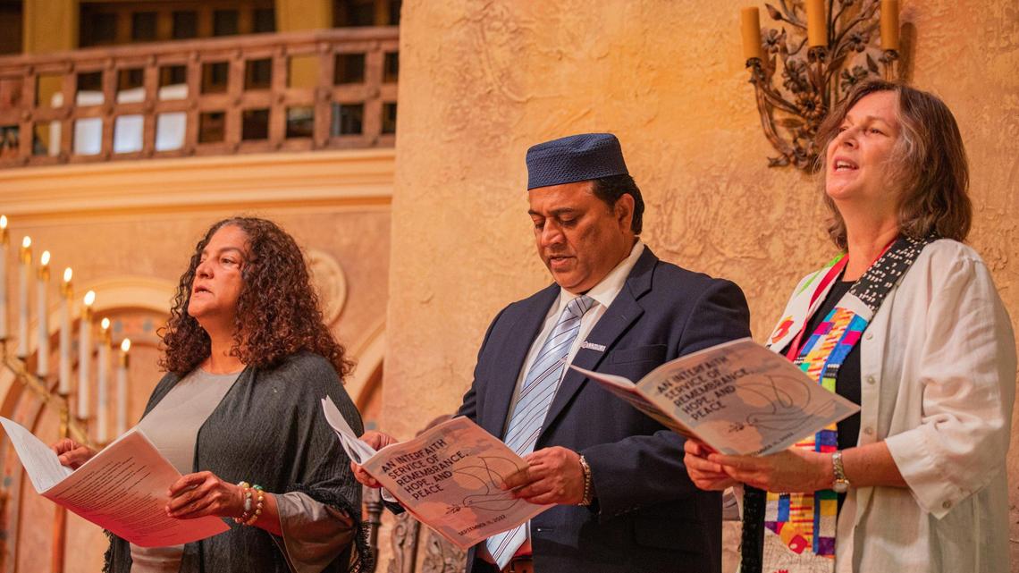 People sing during ‘An Interfaith Service of Remembrance, Hope, and Peace’ on the 21st anniversary of 9/11 at Coral Gables Congregational United Church of Christ in Coral Gables, Florida, on Sunday, Sept. 11, 2022.