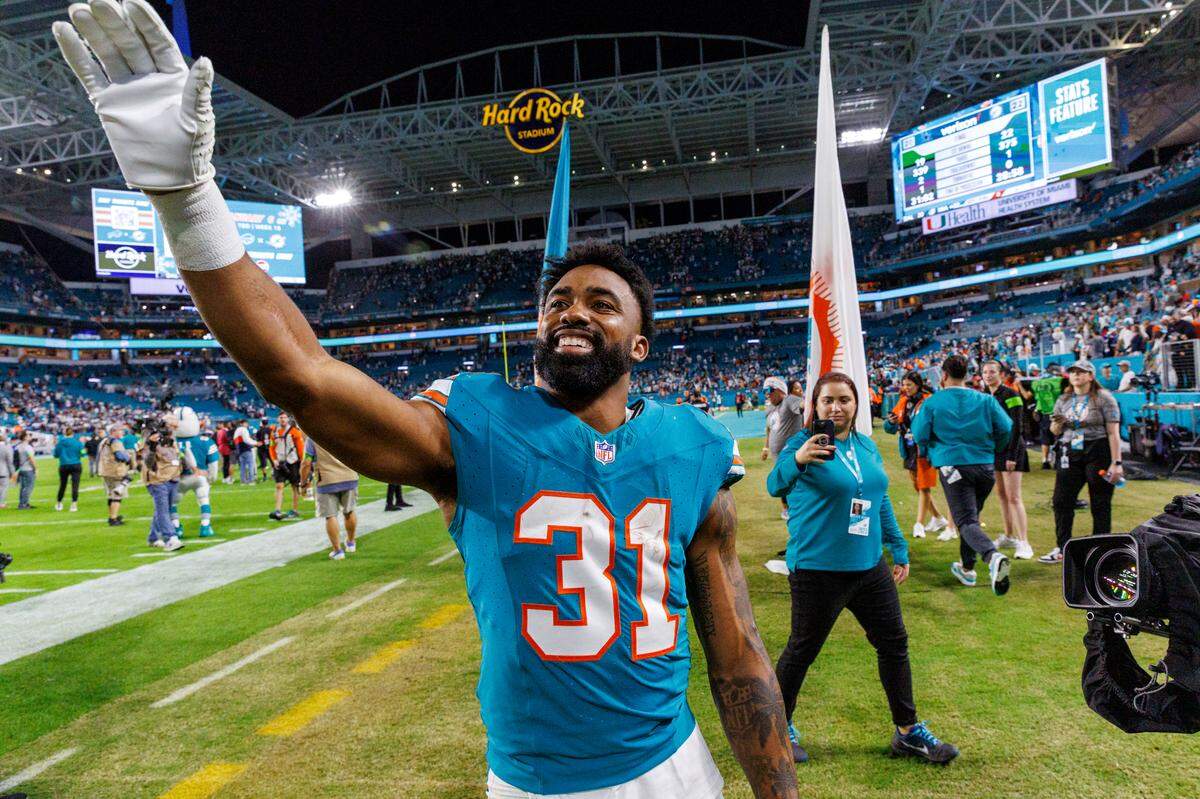 Miami Dolphins running back Raheem Mostert (31) celebrates after the Dolphins 22-20 win over the Cowboys during of an NFL football game at Hard Rock Stadium on Sunday, Dec. 24, 2023 in Miami Gardens, Fl.