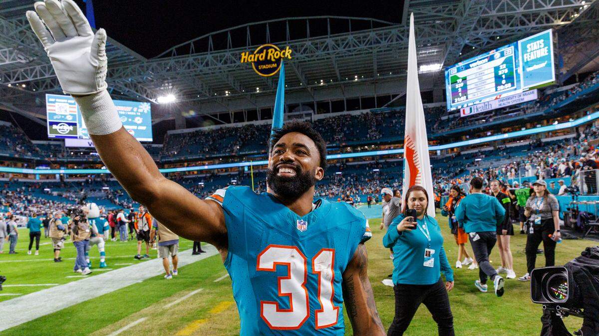 Miami Dolphins running back Raheem Mostert (31) celebrates after the Dolphins 22-20 win over the Cowboys during of an NFL football game at Hard Rock Stadium on Sunday, Dec. 24, 2023 in Miami Gardens, Fl.