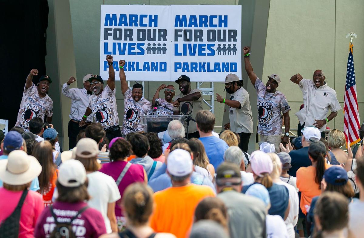 The Circle of Brotherhood reacts while speaking at the March For Our Lives rally at Pine Trails Park on Saturday, June 11, 2022 in Parkland, Fla. One of the main goals of the rally is to increase pressure on politicians to pass laws that help prevent gun violence.