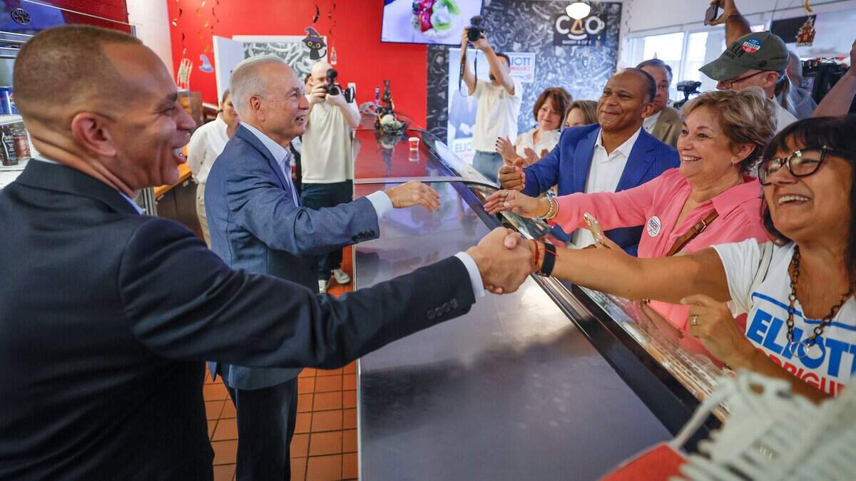 U.S. House Democratic Leader Hakeem Jeffries campaigns alongside Democratic congressional nominee Eliott Rodriguez, at CAO Bakery & Cafe in Pinecrest Florida, on Friday, October 16, 2026.
