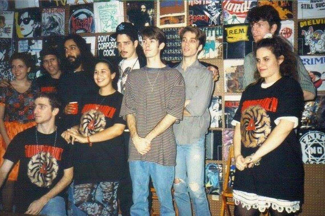 Seattle grunge rockers Soundgarden, with late lead singer Chris Cornell (back row, fourth from left) join Yesterday & Today Records staffers during an in-store appearance at the Red Bird store in December 1991. The group was opening for Guns N’ Roses at Joe Robbie Stadium (now Hard Rock Stadium).