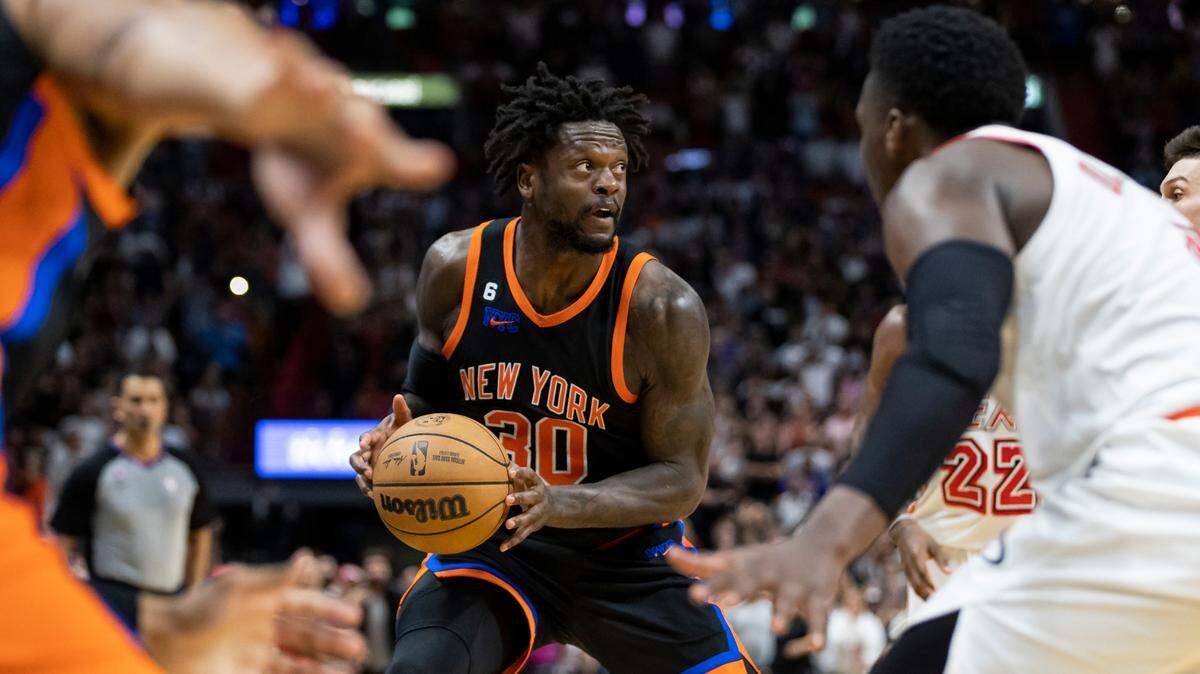 New York Knicks forward Julius Randle (30) looks to take a shot as Miami Heat forward Jimmy Butler (22), guard Tyler Herro (14) and guard Victor Oladipo (4) try to defend during the fourth quarter of an NBA game at Miami-Dade Arena on March 3, 2023, in Miami.