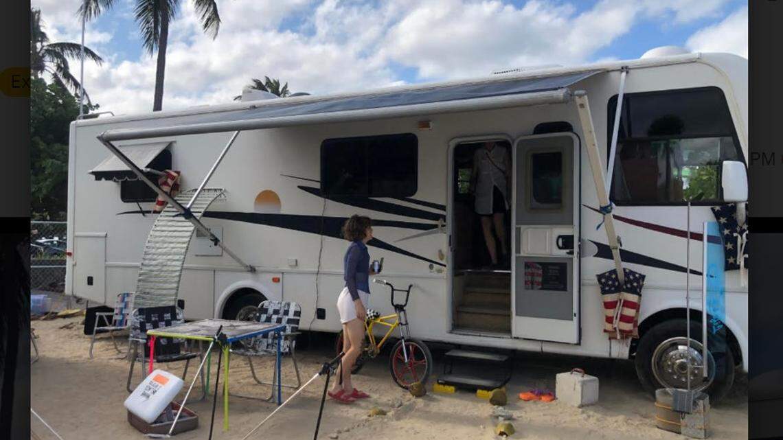 An RV on the sand and giant cabbage patch doll:  Satellite fair is weird and wonderful