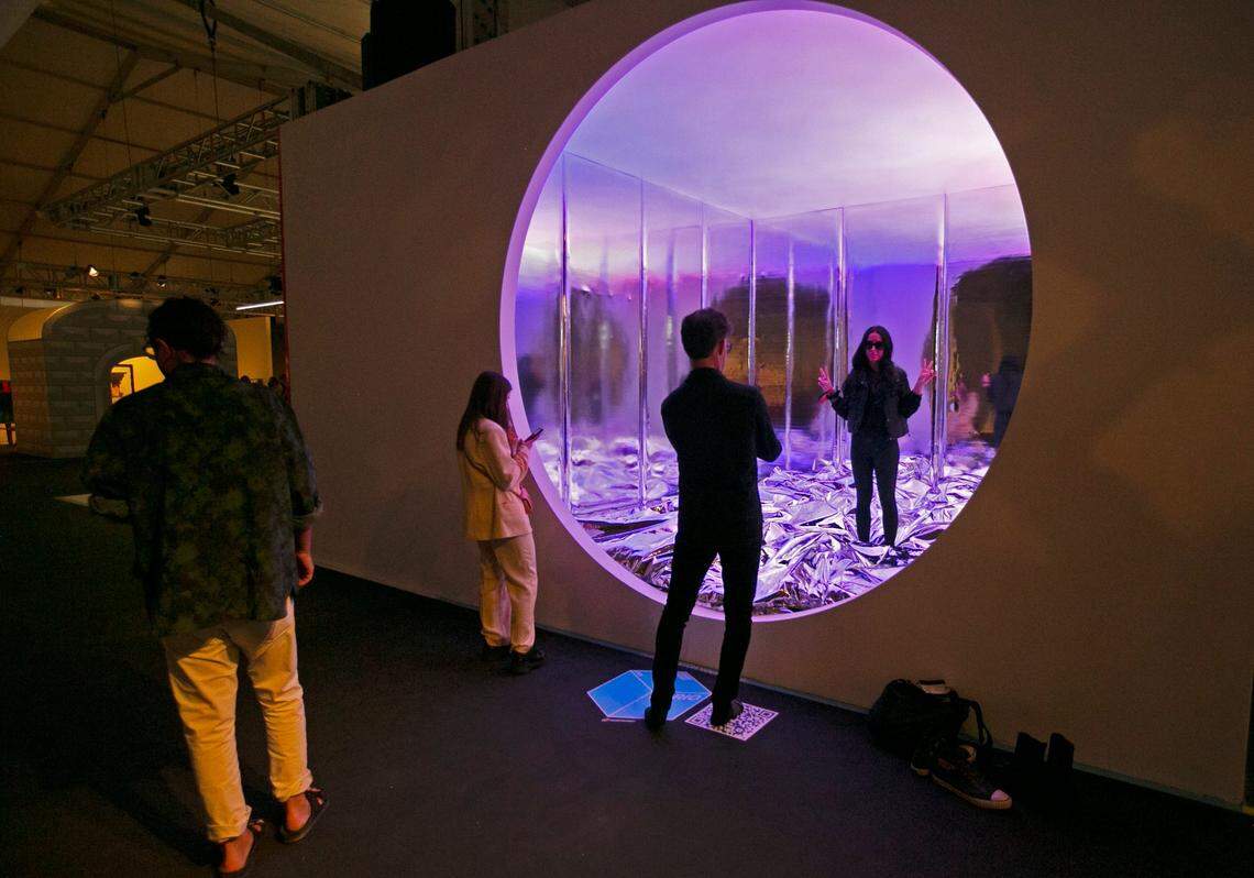 Danielle Payton, of Miami, poses for a photo inside of ’The Bedroom’ by artist Harry Nuriev at Design Miami Nov. 30, 2021.