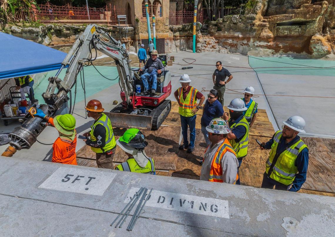 Workers are seen at the Venetian Pool in Coral Gables, which is currently undergoing renovations, on Tuesday, July 22, 2025. The pool has been closed to the public since October.
