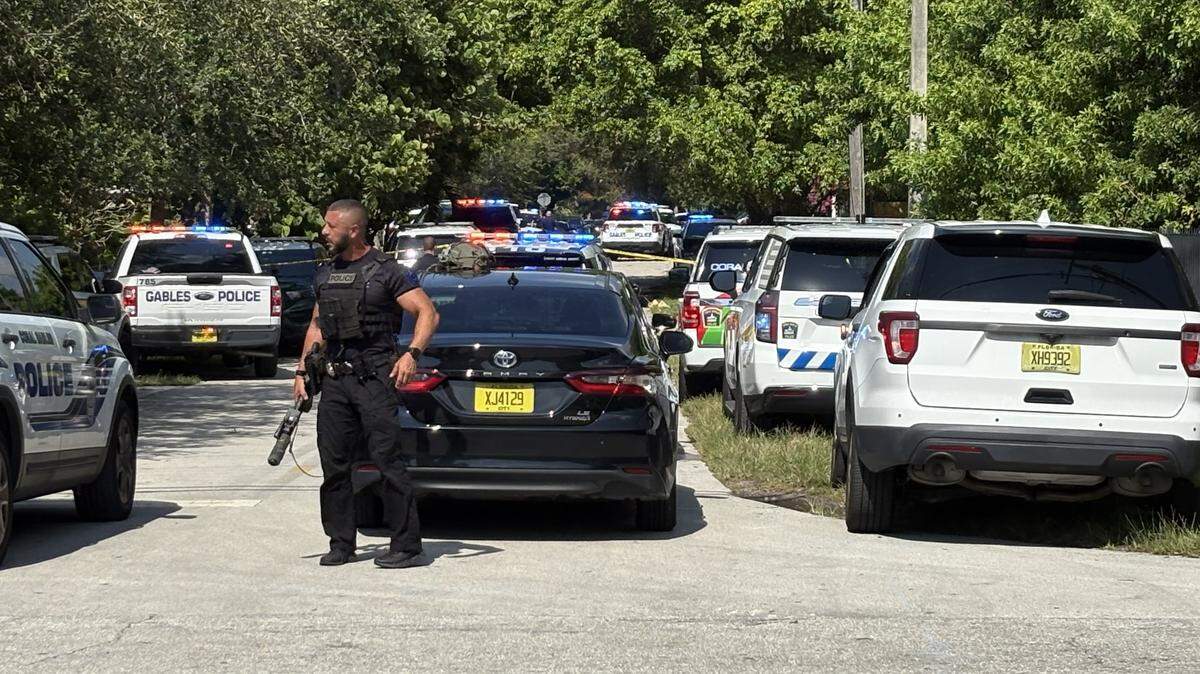 A heavy police presence on Shipping Avenue and Elizabeth Street in Coconut Grove on Friday morning, Aug. 22, 2025, after reports of a stolen car in the Gables led to a police chase and three Grove schools on lockdown.