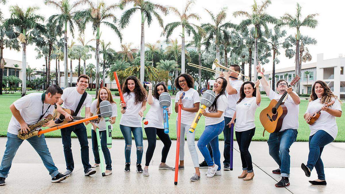 Mind & Melody’s music enrichment specialists, including founders Lauren Koff (third from left with green microphone) and Cristina Rodriguez (far right, holding ukelele).