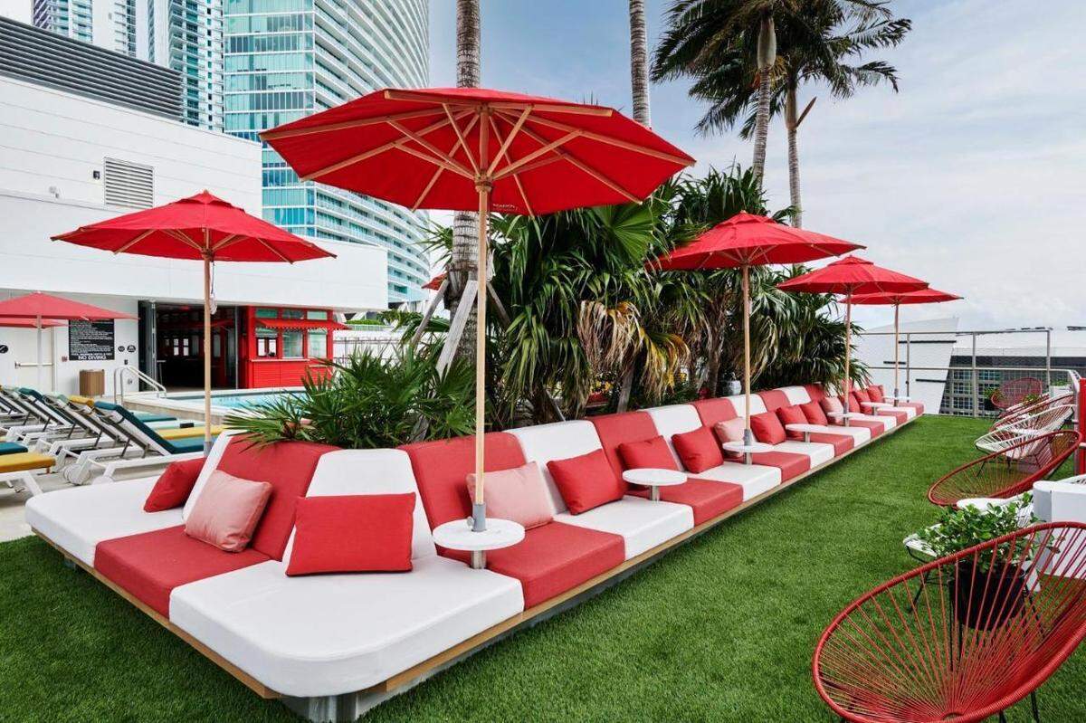 Colorful seating at Night Swim poolside bar, which also serves bar snacks.