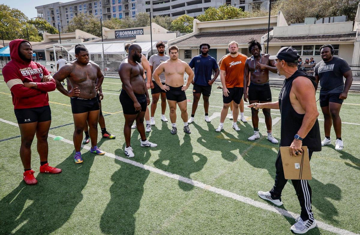 Coach Pete Bommarito speaks with future NFL lineman as they train and learn how to master the 40-yard dash and other drills so they can improve their draft standing in the NFL Combine. They are receiving coaching at Pete Bommarito’s Performance, in Miami, Florida on Wednesday, February 12, 2025.