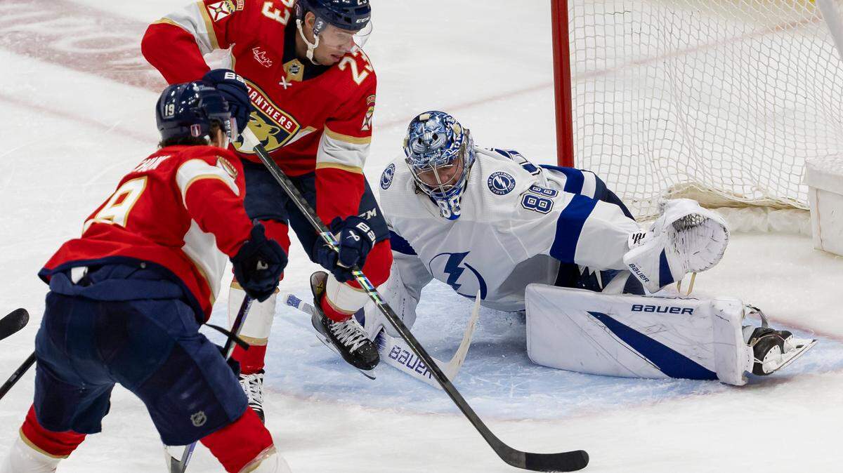 Florida Panthers center Carter Verhaeghe (23) scores a goal against Tampa Bay Lightning goaltender Andrei Vasilevskiy (88) in overtime period in Game 2 of the first-round of the 2024 Stanley Cup Playoffs at Amerant Bank Arena on Tuesday, April 23, 2024, in Sunrise, Fla.