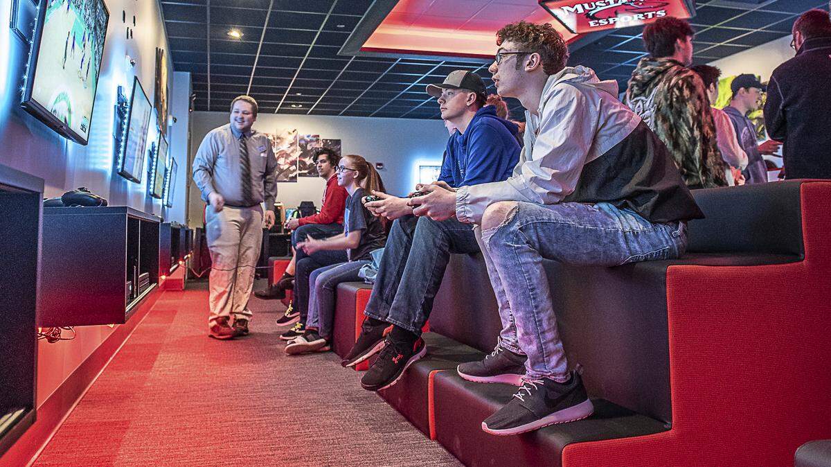 Devon Thibodeau, right, and Ethan Honaker, both juniors at Leavitt High School play a basketball video game at Central Maine Community College’s ESports arena’s open house, Saturday, April 6, 2019, in Auburn, Maine.