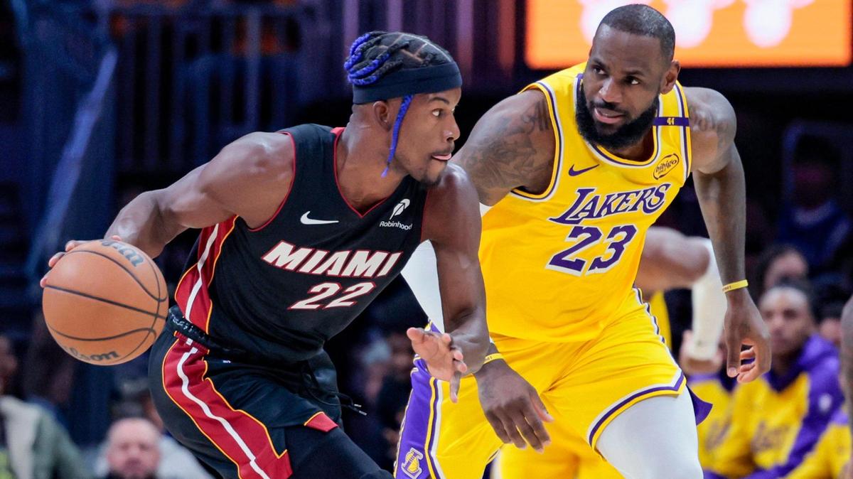 Miami Heat forward Jimmy Butler (22) drives the ball as Los Angeles Lakers forward LeBron James (23) gives chase in the first half of their NBA game at the Kaseya Center in Miami, Florida on Wednesday, December 4, 2024.