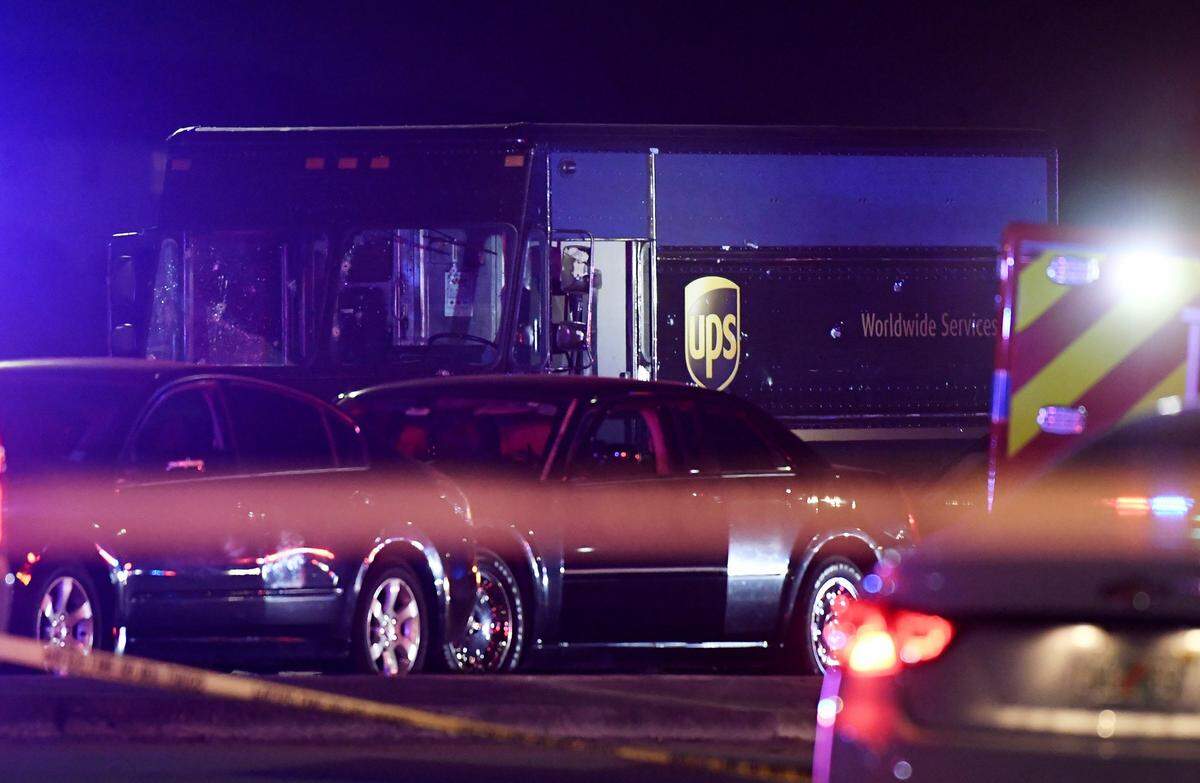 Officers from Miramar Police and Miami-Dade Police work the crime scene at the intersection of Miramar Parkway and Flamingo Road on Dec. 5, 2019. A  jewelry store in Coral Gables was robbed, and the two men who robbed the store hijacked a UPS truck and its driver, leading to a police chase and shootout on the traffic-packed stretch of Miramar Parkway.