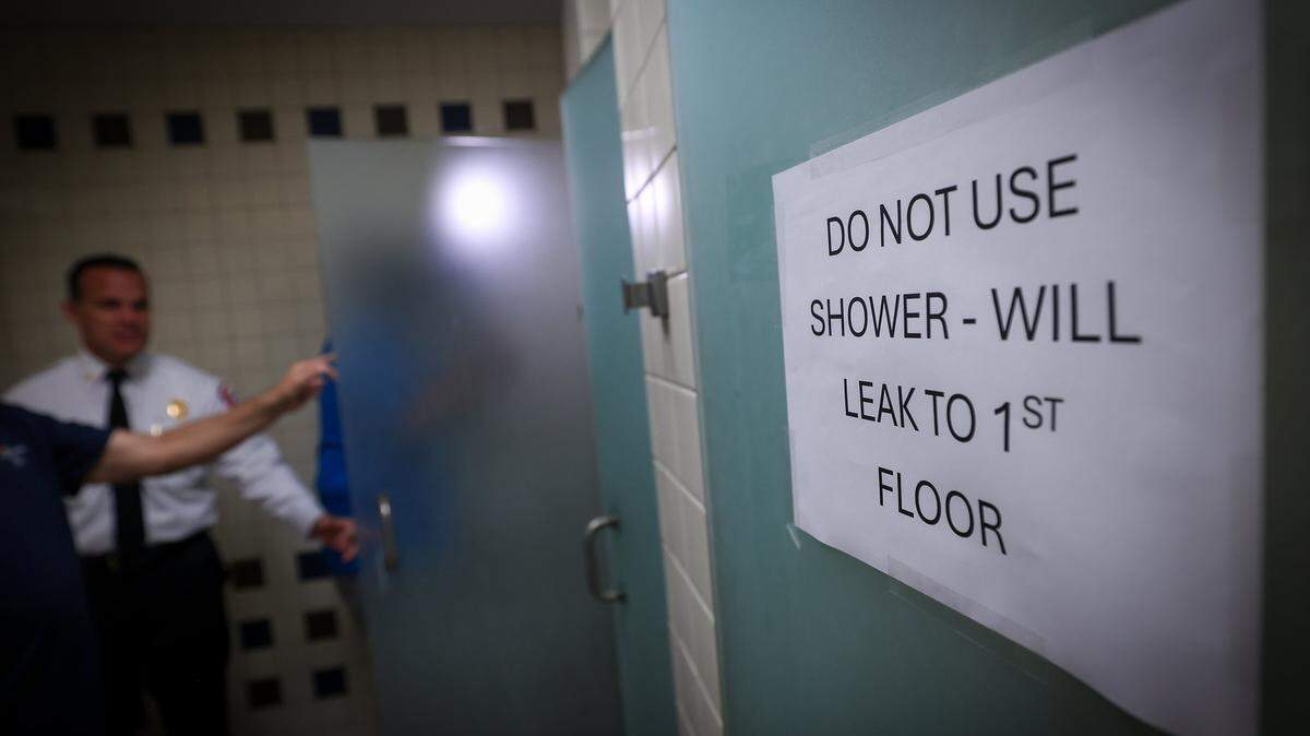 The City of Miami Fire Chief Robert Hevia tours the shower and restroom of Fire Station 1, built in 1964, where mold, water intrusion, and outdated equipment are hampering effective emergency response and community safety during a press tour with the mayor and other officials. Miami Mayor Eileen Higgins toured the city's police and fire facilities in Miami, Florida on Monday, April 20, 2026. Higgins is proposing a general obligation bond to fund critical repairs and upgrades to aging public safety buildings, citing concerns over deteriorating conditions that threaten effective emergency response and community safety.