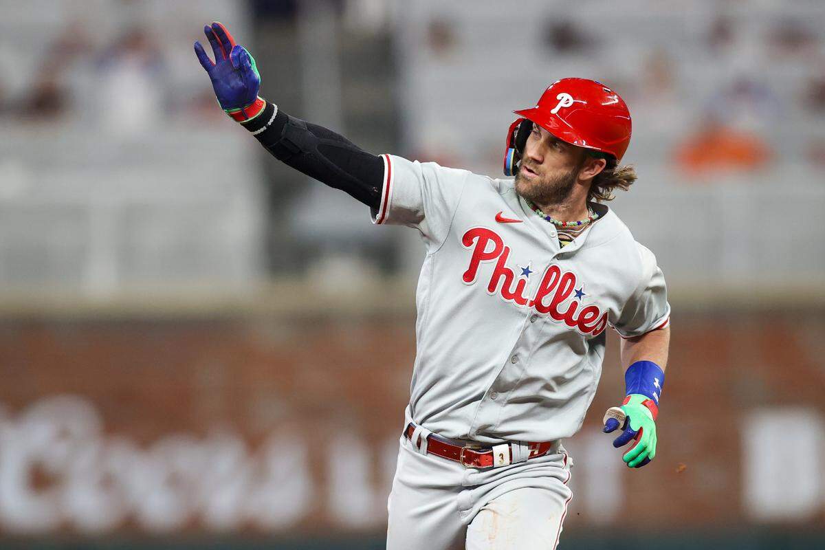 Sep 19, 2023; Atlanta, Georgia, USA; Philadelphia Phillies first baseman Bryce Harper (3) celebrates after a three-run home run against the Atlanta Braves in the sixth inning at Truist Park.