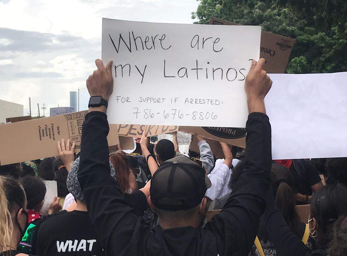 Marvin Pineda holds up a sign during a Miami protest in the wake of George Floyd’s death. It reads: “Where are my Latinos?”