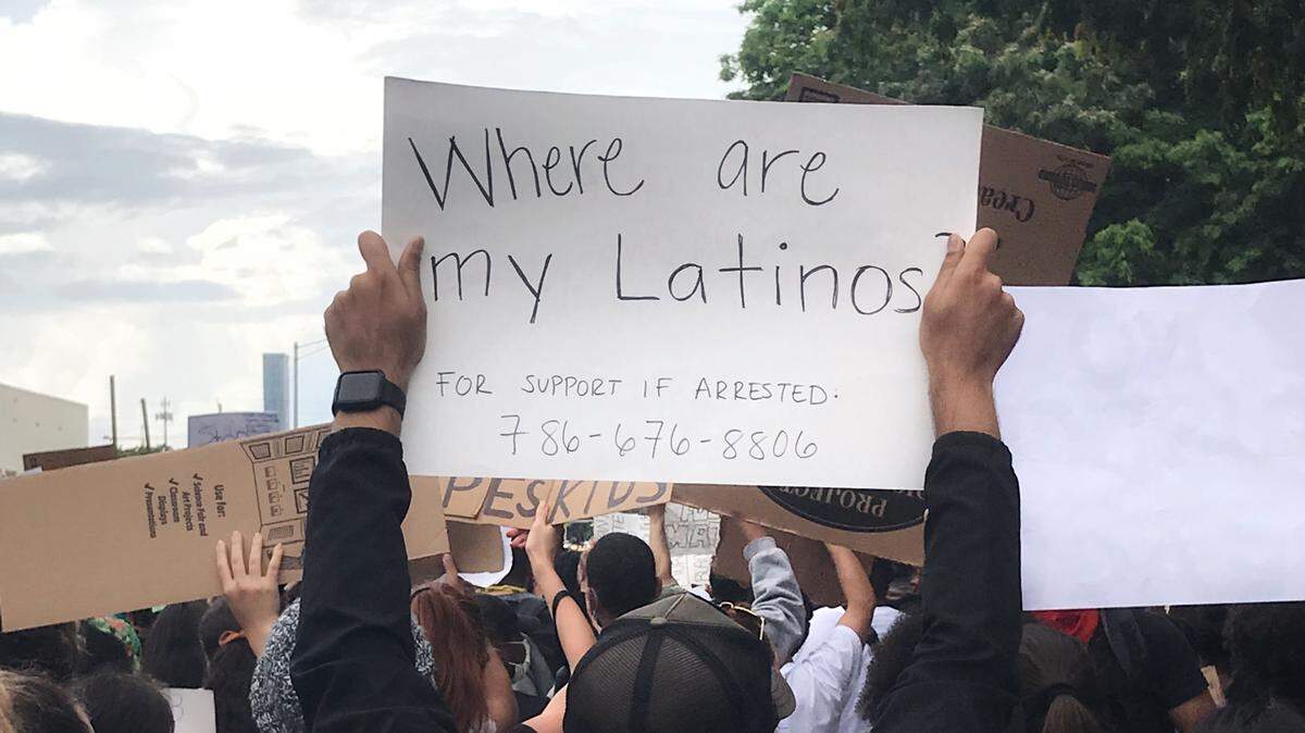 Marvin Pineda holds up a sign during a Miami protest in the wake of George Floyd’s death. It reads: “Where are my Latinos?”