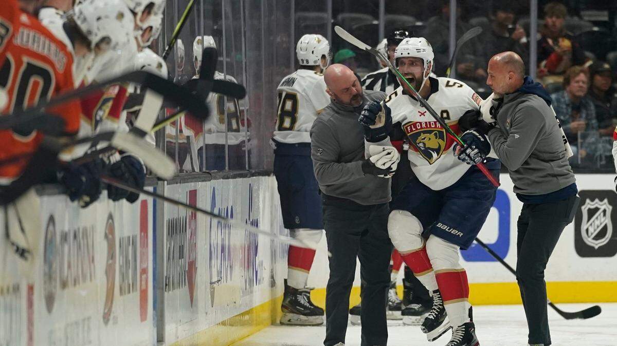 Florida Panthers defenseman Aaron Ekblad (5) is helped off the ice after an injury during the first period of an NHL hockey game against the Anaheim Ducks in Anaheim, Calif., Friday, March 18, 2022. (AP Photo/Ashley Landis)