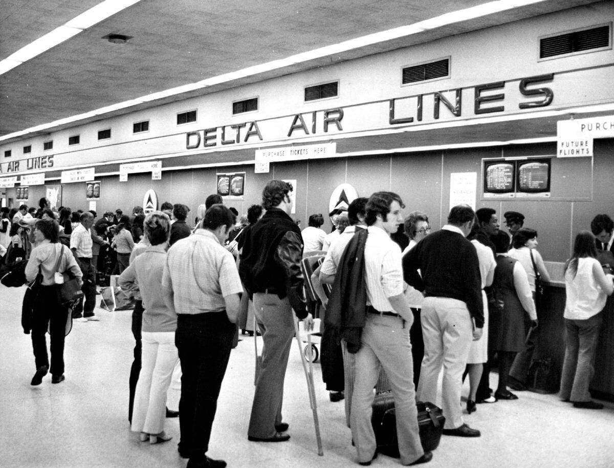 Shot 12/31/1972: Bill Sanders/Miami Herald Staff -- Delta Air Lines desk, Miami Airport Terminal. Published May 27, 1974.