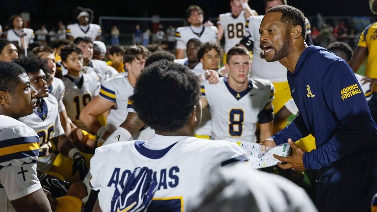St. Thomas Aquinas High School head coach Roger Harriott motivates the team during half time of the game against Chaminade-Madonna High at Chaminade-Madonna High School's Vince Zappone Field in Hollywood Florida Florida, on Friday, October 2, 2026.